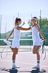 Athletic women stretching before playing a game of tennis, sporty friends bonding at a tennis court. Fit, professional players bonding while warming up, enjoying their friendship before competing 