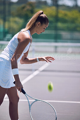 Buy stock photo Female tennis player with ball and racket gear in a tournament match or fun outdoor hobby activity. Sports, active and fit woman preparing to serve opponent during a competitive or training exercise