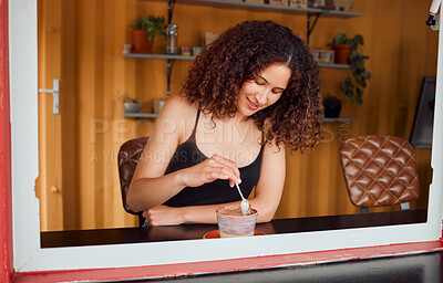 Buy stock photo Relaxed, casual woman enjoying hot chocolate, coffee or beverage at a cafe. Young and cool girl taking a break while drinking cocoa in a cup or mug inside a trendy startup coffee shop or diner