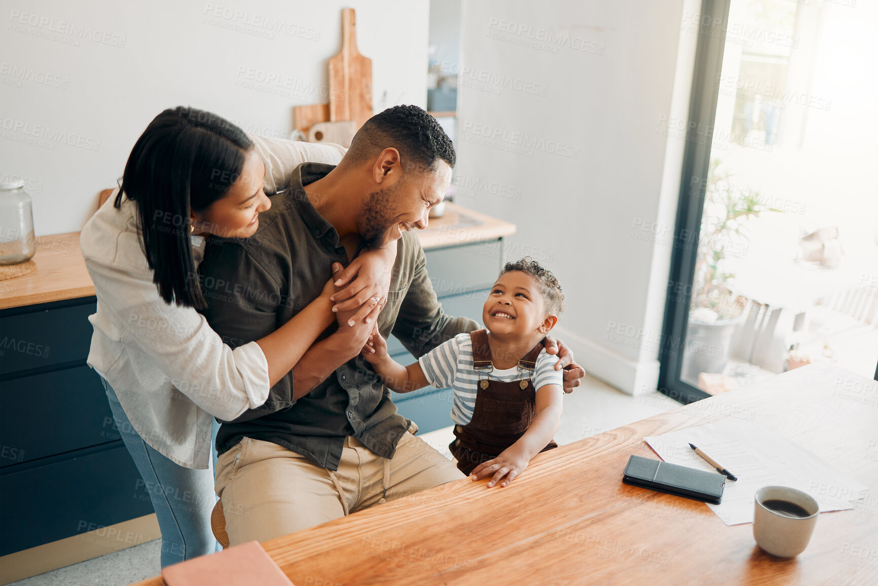 Buy stock photo Family fun with playful, funny and happy child with a laughing parents hugging at home. Cheerful mother, father and small child with a smile relax, enjoy and spend time together at their house 