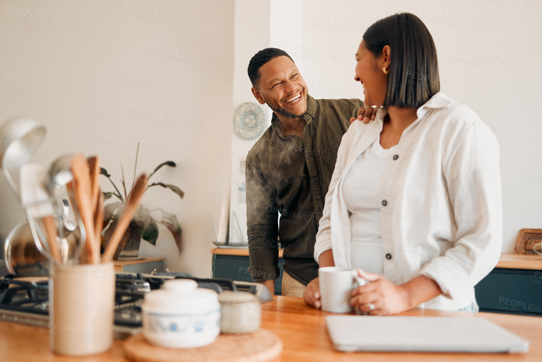 Buy stock photo Smiling, laughing and loving, a couple in the kitchen with coffee. Happy, loving and relaxing, romantic new homeowners their house. Romance, marriage and fun, man and woman in love at the family home