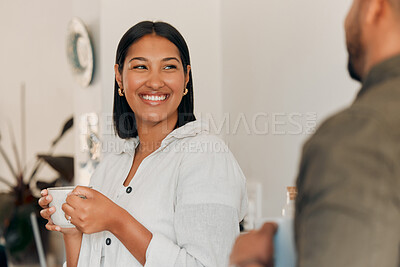 Buy stock photo Woman drinking coffee, having conversation and bonding with her husband at home. Smiling, happy and relaxed wife enjoying quality time, romantic and peaceful moment as a couple in loving relationship