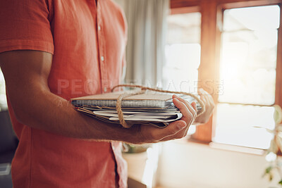 Buy stock photo Recycling newspaper and magazine, sustainability and the planet and environment, green and clean energy for happy future. Man with paper and rope bundle, recycle and reuse in eco friendly modern home