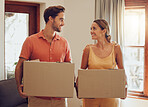 Moving, home and couple holding boxes while looking happy with their choice. Relationship, growth and investing for future of family. Purchase, investment and house loan approved for people in love.