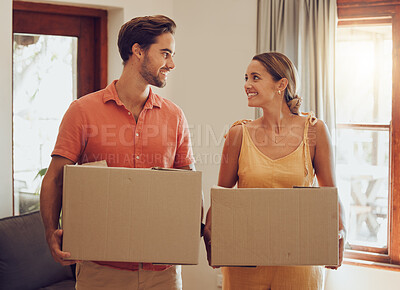 Buy stock photo Moving, home and couple holding boxes while looking happy with their choice. Relationship, growth and investing for new future. Purchase, investment and house loan approved for people in love.