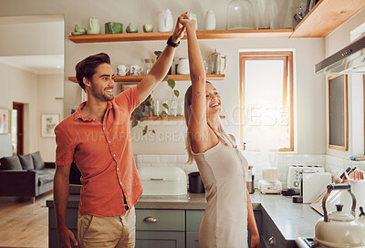 Buy stock photo Happy, dancing and loving couple bonding and having fun while spending time together at home. Energetic, fun and active couple sharing a dance and romantic moment while enjoying their anniversary