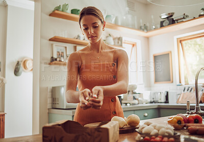 Buy stock photo Healthy, organic and fresh food and vegetables ready for cooking with a young woman in a kitchen. Female nutritionist ready to make a nutrition, weight loss and health diet meal for dinner at home