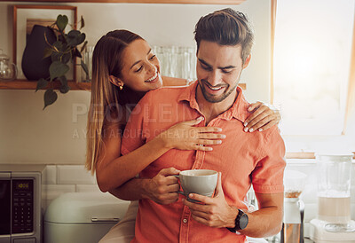 Buy stock photo Happy, in love and carefree couple embracing, bonding and being affectionate at home together. Young boyfriend and girlfriend hugging, relaxing, talking, being playing and enjoying their relationship