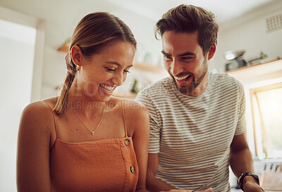 Buy stock photo Happy laughing couple with smile bonding and having fun while having time together at home. Joke, in love and carefree couple talking and sharing a funny moment while enjoying the weekend.