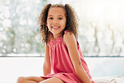 Buy stock photo Happy child, cute curls and girl with adorable, sweet and happy smile relaxing at home. Portrait of comfortable, fun and young kid growing with healthy development, youth and adolescence