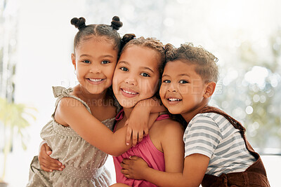 Buy stock photo Siblings, boy and girl children hugging and bonding together as a cute happy family indoors during summer. Portrait of young, brother and sister kids smiling, embracing and enjoying their childhood