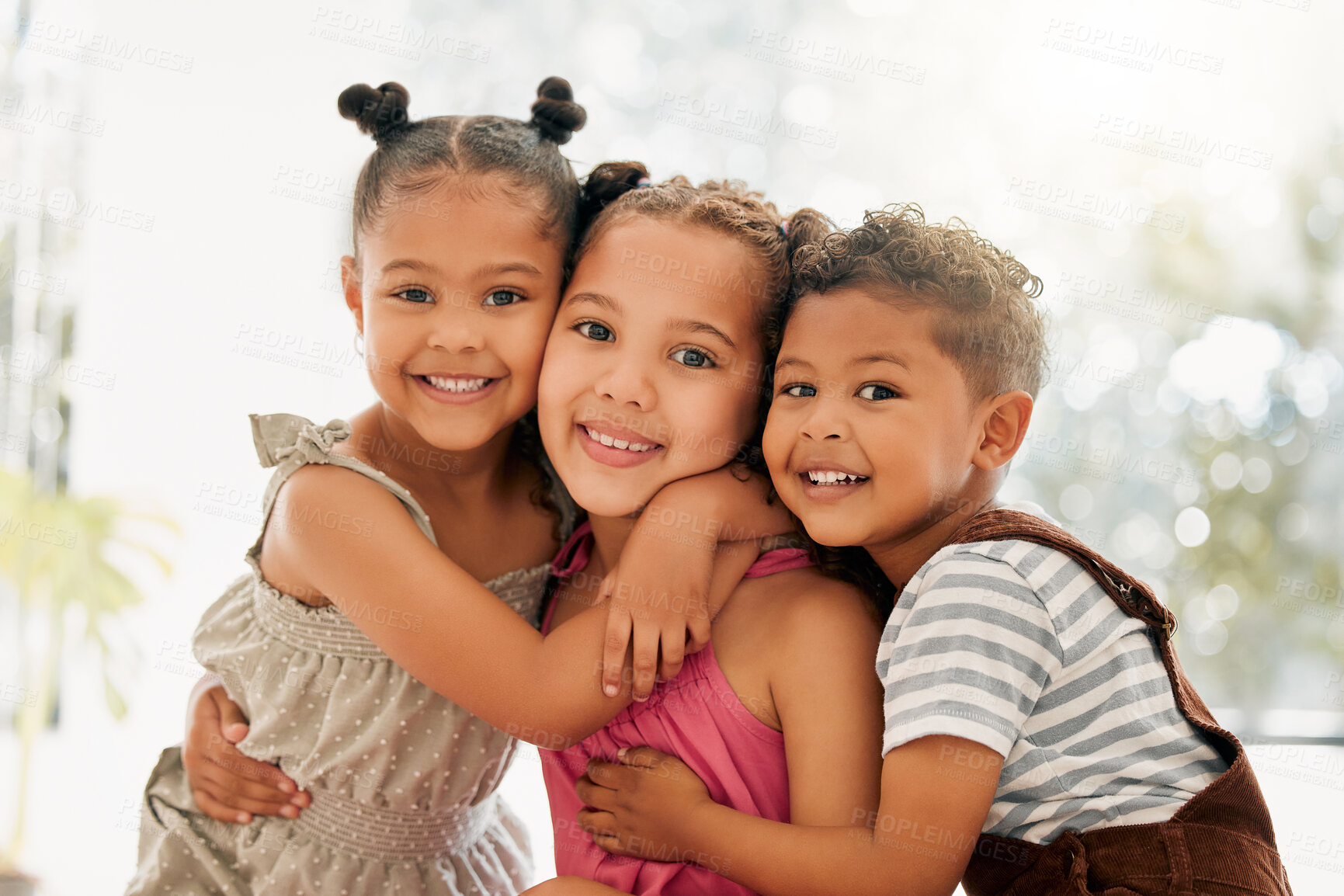 Buy stock photo Siblings, boy and girl children hugging and bonding together as a cute happy family indoors during summer. Portrait of young, brother and sister kids smiling, embracing and enjoying their childhood