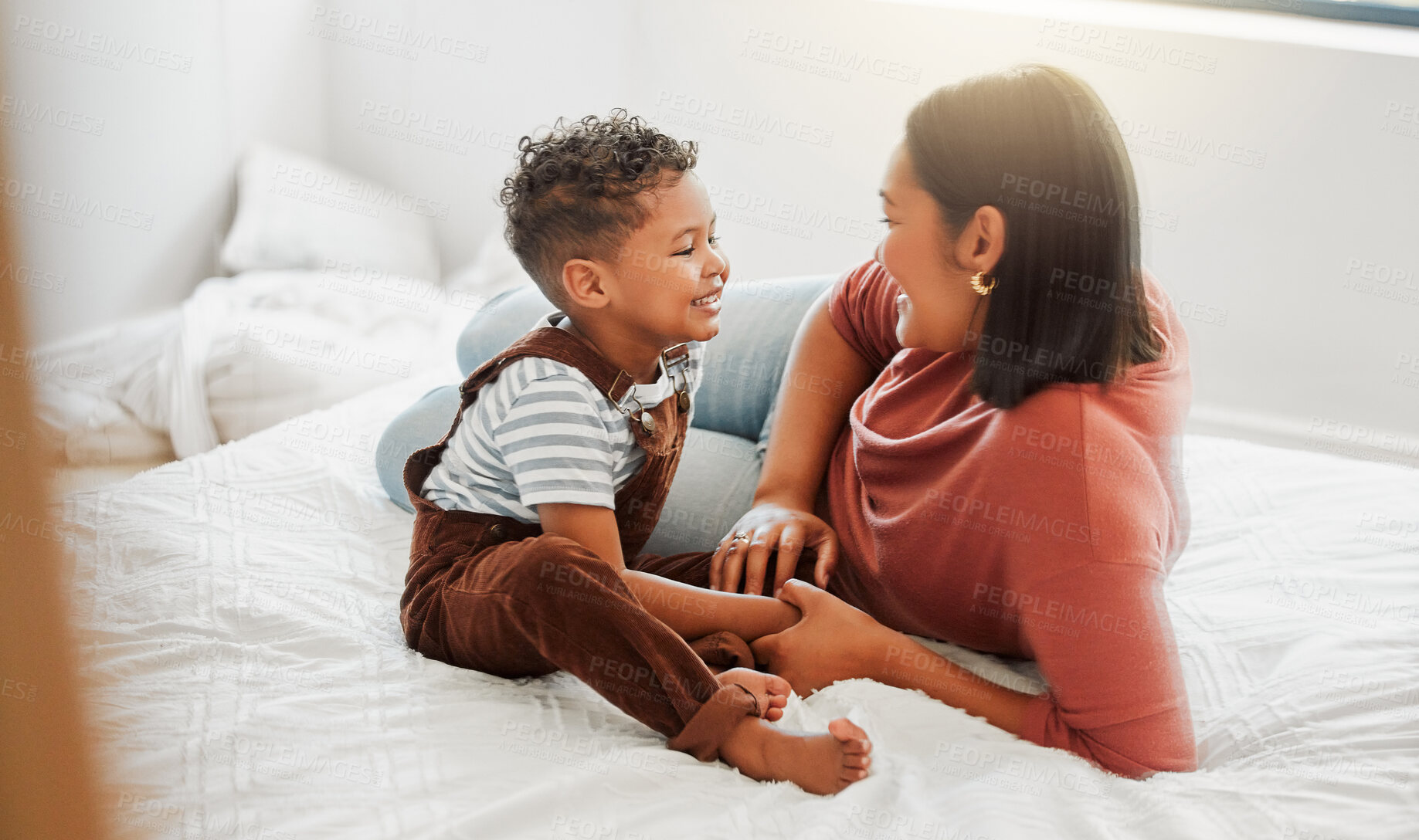 Buy stock photo Childcare, love and caring mother playing with toddler son in bedroom, teaching him to talk in a bed room at home. Single parent or mom showing love, affection and care for baby boy, bonding together