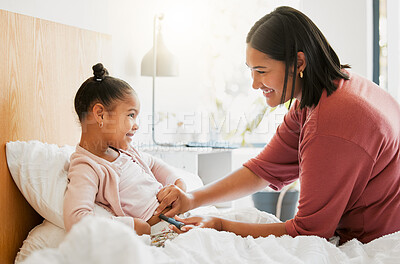 Buy stock photo Diabetes, insulin and diabetic happy girl getting injected by her mom in her bedroom for their morning routine at home. Family, mom and kid smiling, medicating and using a finger stick for blood test