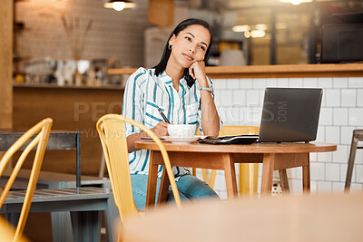 Buy stock photo Thinking, wondering and thoughtful female entrepreneur working in a coffee shop planning a mission or vision. Young woman doing remote work in a cafe looking into the distance while writing