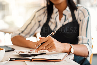 Buy stock photo Hands of business owner taking orders, calculating profit and working on budget for startup while sitting at a table at work. Closeup of a female employee doing finance job, sorting bill and writing