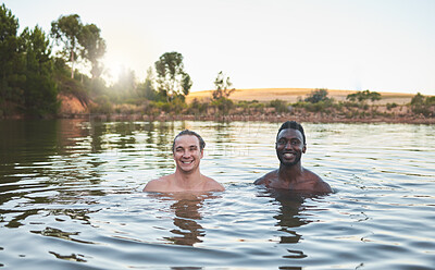 Buy stock photo Vacation, friends and having fun while swimming in a lake and enjoying summer. Portrait of happy and diverse guys smiling while enjoying the water and friendship on their holiday and nature travel