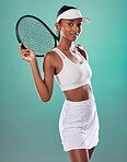 Tennis player, sports uniform and racket in the hands of a beautiful woman looking happy and ready to play with a positive attitude. Confident and sporty female standing against a studio background