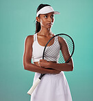 Thinking tennis player, fitness athlete and active woman ready for training with racket in cool fashion and sports uniform while posing on green studio background. Healthy and serious young female