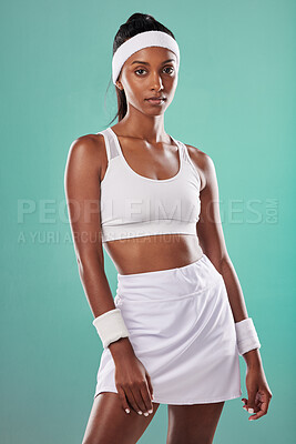 Buy stock photo Fit, athlete or female tennis player or serious sportswoman ready for competition or a match. Portrait of an African American athletic female in sportswear against a green studio background