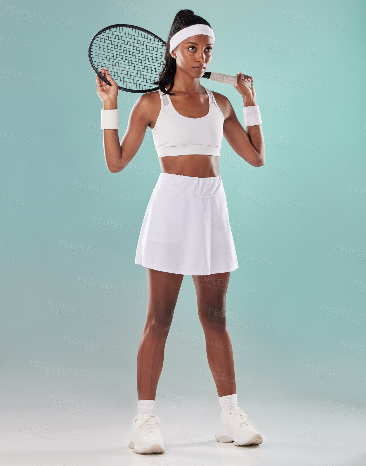 Buy stock photo Black woman, tennis player or sports athlete training for a game. Motivation, fitness and a focus on health, exercise and wellness. A healthy African girl standing with a racket in a studio portrait.