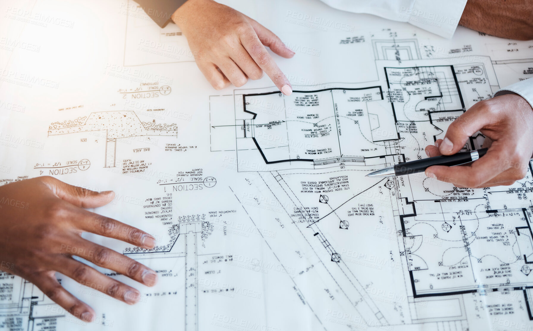 Buy stock photo Hands of architects, engineers and building construction workers planning project with blueprint in meeting at work, working on house and talking with document. Creative designer with paper at table