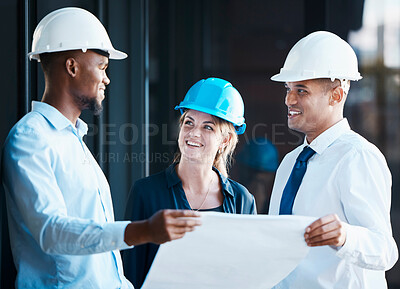 Buy stock photo Architect, engineer and building contractor looking at plans or blueprints while talking and discussing strategy. Team or group of builders looking motivated and ready to develop, renovate or remodel