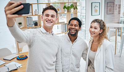 Buy stock photo Group of friends taking a selfie, with a phone and spending time together in a modern office. Excited, happy and laughing multiracial group of young people taking a photo on a mobile at a party

