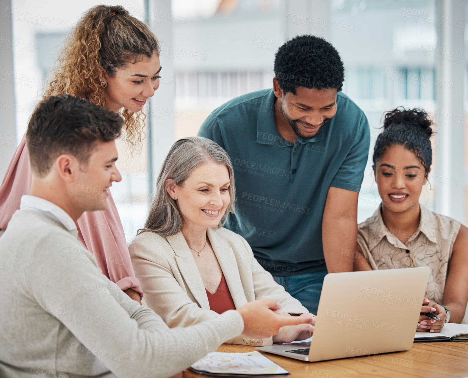Buy stock photo Teamwork, togetherness and unity with a team of colleagues and female leader, boss or manager working on a laptop during a boardroom meeting in the office. Planning, discussing and talking strategy