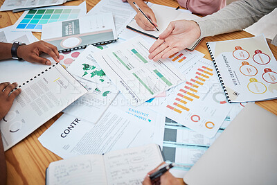 Buy stock photo Above table with finance papers, graphs and big data during teamwork meeting with accounting or marketing team discussing budget, strategy or growth development. Closeup of SEO team doing research