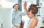 High five, excited and celebrating call center agents with computers happy with a successful deal, promotion and sale. Smiling, cheering and motivated contact us customer service operators in office