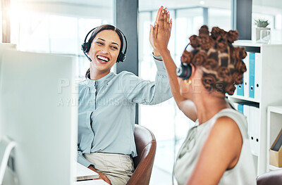 Buy stock photo High five, excited and celebrating call center agents with computers happy with a successful deal, promotion and sale. Smiling, cheering and motivated contact us customer service operators in office