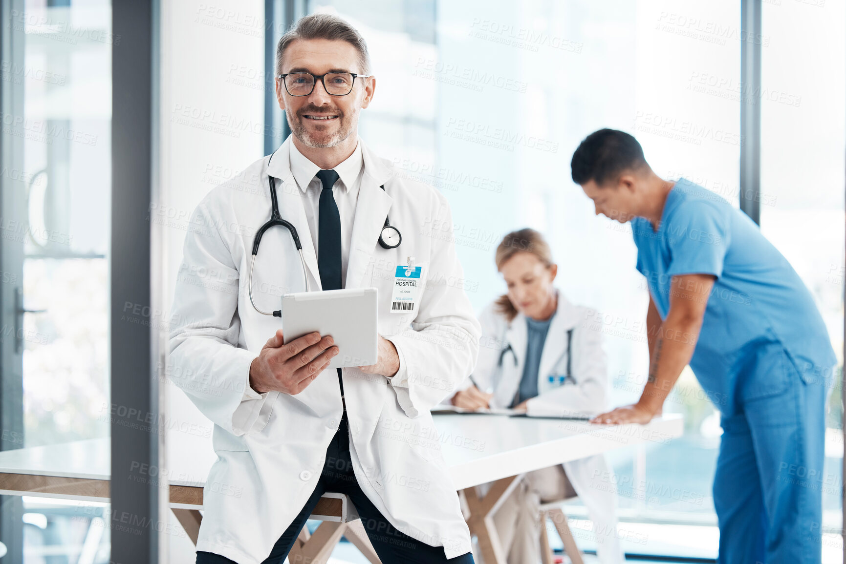 Buy stock photo Technology, innovation and new medicine with expert science working in the healthcare field. Medical doctor, happy and using tablet in the boardroom after a meeting at a hospital, team in background