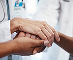 Doctor, holding a patient's hands and comforting them after the loss of a loved one at a hospital. Medical consultant, reassuring sick person after a cancer diagnosis and giving support or treatment.