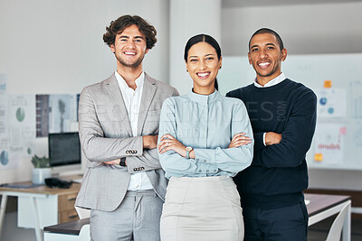 Buy stock photo Teamwork, unity and togetherness with a corporate team portrait of colleagues standing arms crossed in their office at work. Young, motivated and ambitious business people with a mindset of growth