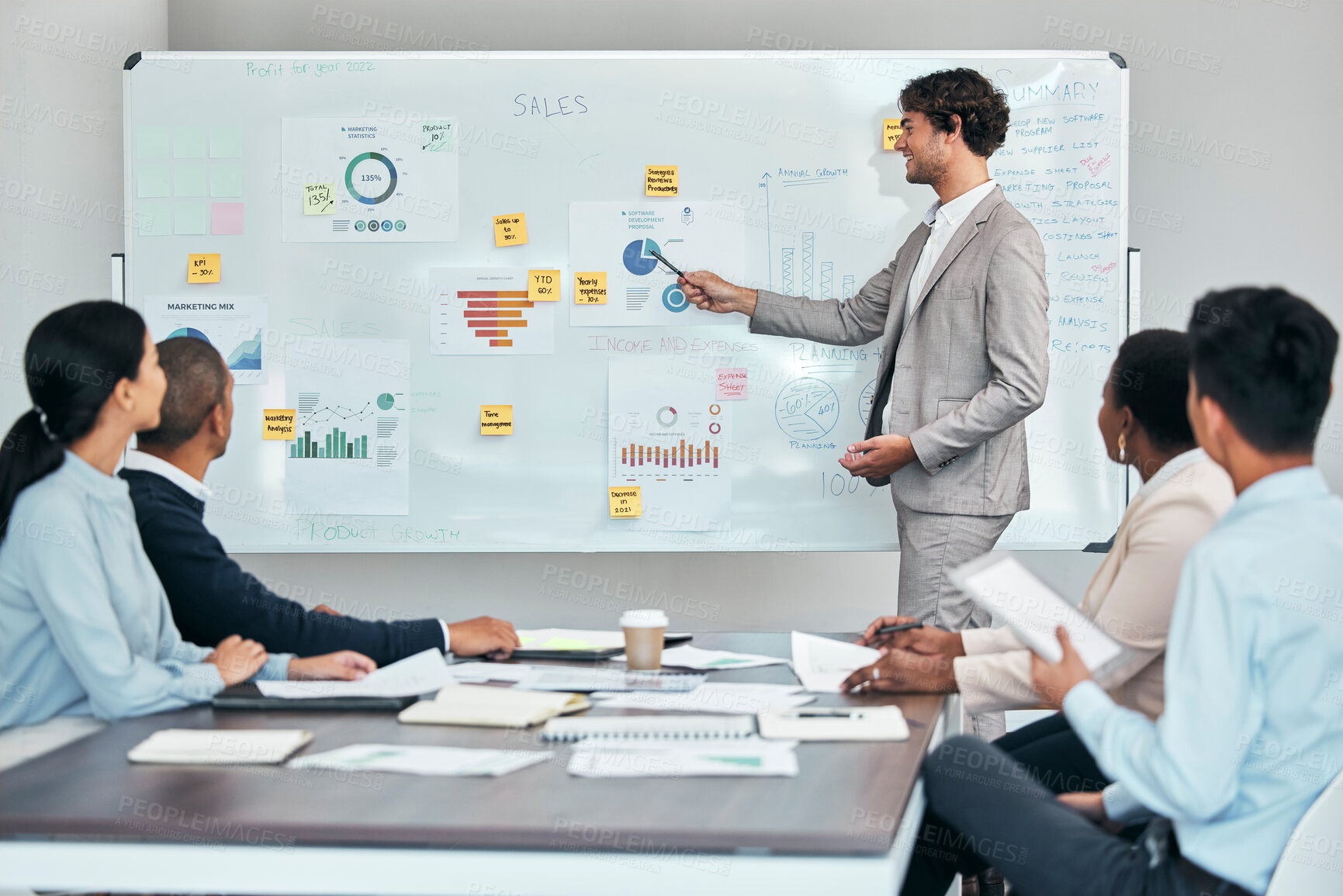 Buy stock photo Business leader or coach presenting financial or marketing budget report, accounting statistics or sales charts on white board. Company finance growth strategy and project management team meeting.
