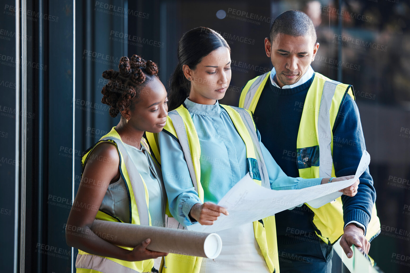 Buy stock photo Construction, architect plans and diverse engineers consulting and planning a design as a team. Group of creative, professional and successful industry workers analyzing architecture documents.