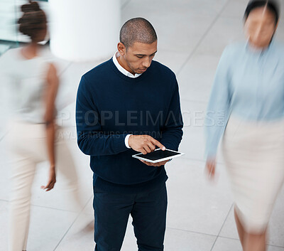 Buy stock photo Busy office with business man on tablet browsing, planning and scrolling for online research, mobile notes and digital ideas from above. Organized entrepreneur working on plan in a bustling workplace