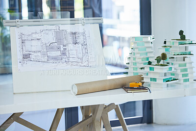 Buy stock photo Architecture, design and blueprints on an office desk with plans and a building model for the construction industry. Architect office, planning and equipment in a modern and creative workplace