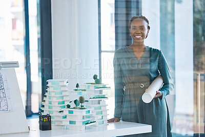 Buy stock photo Architect, engineer and designer holding a blueprint with a positive mindset, mission and vision in an office. Portrait of a black woman standing next to 3D representation of proposed building design