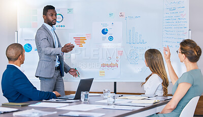 Buy stock photo Presentation, strategy discussion or meeting of business man briefing his colleagues in a boardroom. African American leader accountant answers questions in an office while discussing finance