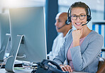Call center agent, telemarketing employee or customer service worker is happy and smiling in the office. Portrait of a caucasian female sales representative ready and excited to help and answer calls