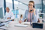 Smiling receptionist, business woman or customer service employee consulting on phone in telemarketing call center office. Happy corporate or crm support manager working in contact us helpdesk 