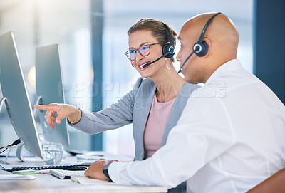 Buy stock photo Call centre agent, telemarketing and sales representative colleague with desktop computer talking, showing or looking at online software app or website. Global business agency manager discussing work