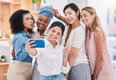 Buy stock photo Fun, diverse and playful team selfie on phone and having fun, goofing around or making peace sign gesture. Cheerful goofy group of business friends or creative colleagues posing for social media post