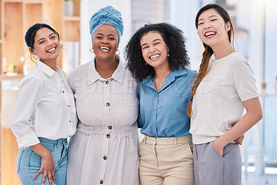 Buy stock photo Diverse, happy and smiling portrait of a creative team of designers standing in a modern office. Young successful group of friendly casual coworkers, employees or colleagues posing at the workplace.