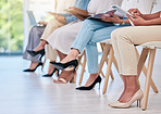 Feet, shoes or heel of business woman marketing team sitting browsing online while planning, collaborating and working in a creative office. Diverse group of employees waiting in line at an interview