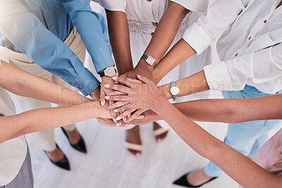 Buy stock photo United, successful or ambitious businesspeople hands stacked together in a work office. Business professionals having fun standing with their hands piled for motivation during a meeting from above