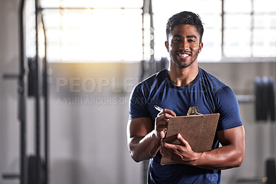 Gym, workout and personal trainer with clipboard consulting a training sports client in gym. Portrait of muscular, active and smiling fitness coach writing on health, wellness and exercise with flare