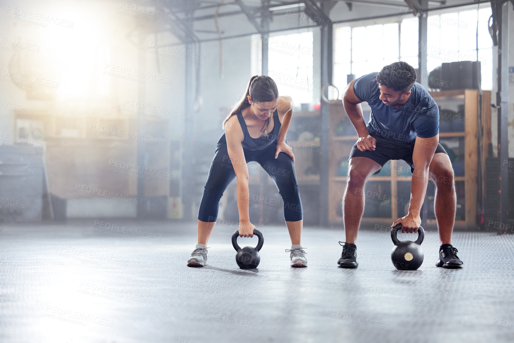 Buy stock photo Fitness couple doing a kettlebell workout, exercise or warmup training in a gym. Fit sports people, woman and man with a strong grip, exercising using equipment to build muscles and forearm strength.
